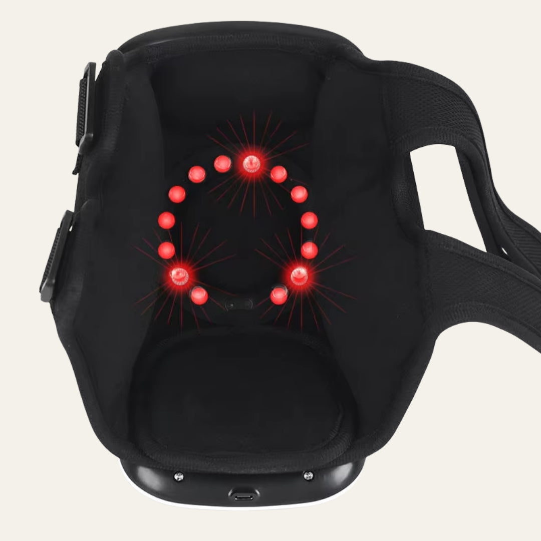AuraKnee Pro with the red light ring lit inside the shell