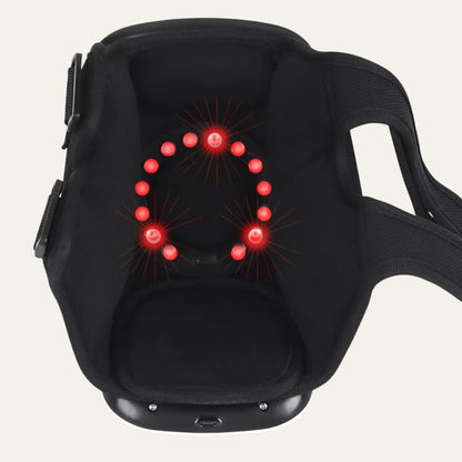 AuraKnee Pro with the red light ring lit inside the shell